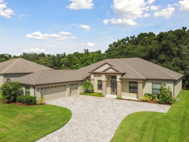 Move in ready 4 beds + 3 baths + 3 car OVERSIZED 35' x 21' side on Lake Jovita Golf and Country Club in Florida - for sale on GolfHomes.com, golf home, golf lot