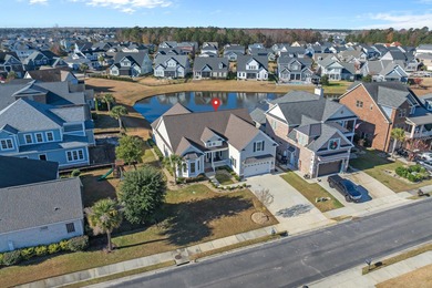 This exquisite single-level home on a pristine lake lot in the on Myrtlewood Golf Course and Club  in South Carolina - for sale on GolfHomes.com, golf home, golf lot