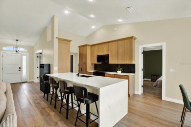Wake up to panoramic views of tranquil lakes and the perfectly on Links At Greenfield Plantation in Florida - for sale on GolfHomes.com, golf home, golf lot