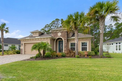 Gorgeous pool home nestled on an oversized, beautifully on Plantation Bay Golf and Country Club in Florida - for sale on GolfHomes.com, golf home, golf lot