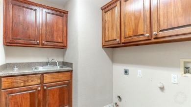 This three bedroom, two bathroom, large three car garage is on Granbury Country Club in Texas - for sale on GolfHomes.com, golf home, golf lot