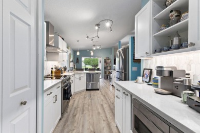 Luxuriously upgraded 3-bed, 2-bath lakefront home with over 1 on Spanish Lakes Fairways in Florida - for sale on GolfHomes.com, golf home, golf lot