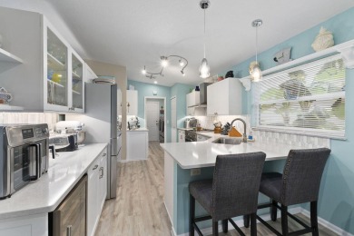 Luxuriously upgraded 3-bed, 2-bath lakefront home with over 1 on Spanish Lakes Fairways in Florida - for sale on GolfHomes.com, golf home, golf lot