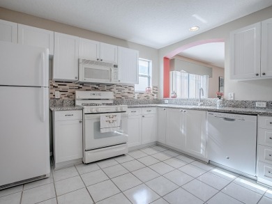 Welcome to your dream home, where comfort meets an active on The Links of Spruce Creek in Florida - for sale on GolfHomes.com, golf home, golf lot