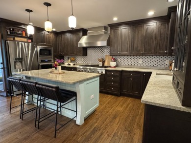Introducing an exquisite 5-bedroom, 4-bathroom family residence on Timber Ridge Golf Club in Wisconsin - for sale on GolfHomes.com, golf home, golf lot