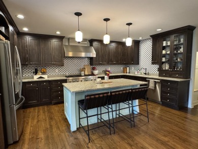 Introducing an exquisite 5-bedroom, 4-bathroom family residence on Timber Ridge Golf Club in Wisconsin - for sale on GolfHomes.com, golf home, golf lot