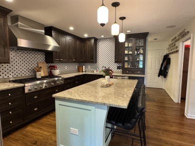 Introducing an exquisite 5-bedroom, 4-bathroom family residence on Timber Ridge Golf Club in Wisconsin - for sale on GolfHomes.com, golf home, golf lot