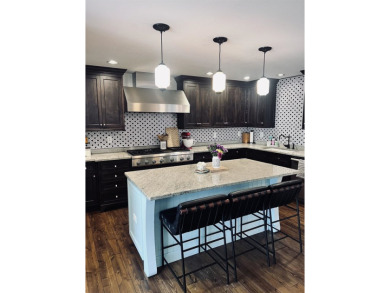 Introducing an exquisite 5-bedroom, 4-bathroom family residence on Timber Ridge Golf Club in Wisconsin - for sale on GolfHomes.com, golf home, golf lot