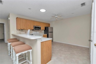 Welcome to this charming 2-bedroom, 2-bathroom home located in on The Links of Spruce Creek in Florida - for sale on GolfHomes.com, golf home, golf lot