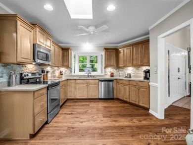 Immaculate golf course home overlooking the 16th fairway of on Rumbling Bald Resort on Lake Lure in North Carolina - for sale on GolfHomes.com, golf home, golf lot