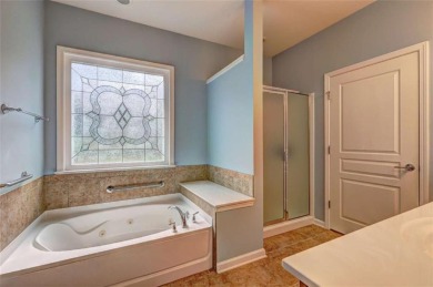 Experience this beautifully updated ranch-style home within an on Canongate Golf At Sun City Peachtree in Georgia - for sale on GolfHomes.com, golf home, golf lot
