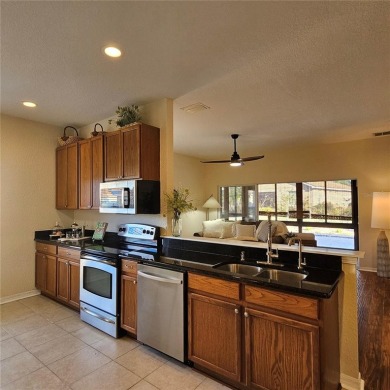 Enter this cozy home that offers the perfect space for a single on Lake Ashton Golf Club in Florida - for sale on GolfHomes.com, golf home, golf lot