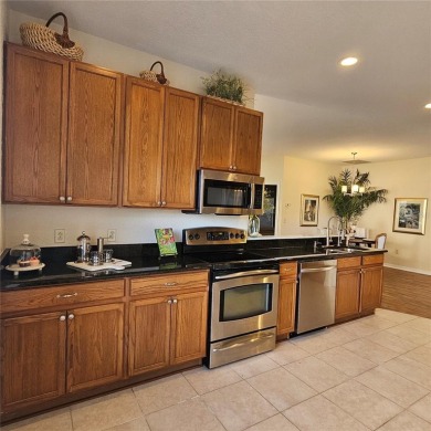 Enter this cozy home that offers the perfect space for a single on Lake Ashton Golf Club in Florida - for sale on GolfHomes.com, golf home, golf lot