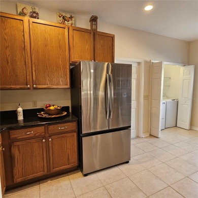 Enter this cozy home that offers the perfect space for a single on Lake Ashton Golf Club in Florida - for sale on GolfHomes.com, golf home, golf lot