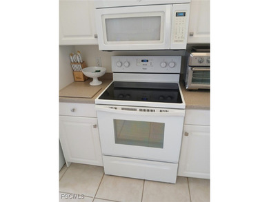 This charming condo located at 5877 Three Iron Drive in Naples on The Club At Strand in Florida - for sale on GolfHomes.com, golf home, golf lot