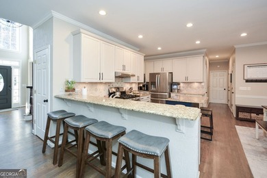 Imagine pulling into the driveway of a stunning traditional on Canongate At Eagle Watch Golf Club in Georgia - for sale on GolfHomes.com, golf home, golf lot