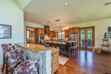 Welcome to 109 King Shore Blvd, a luxury waterfront retreat in on Cypress Creek Country Club in Texas - for sale on GolfHomes.com, golf home, golf lot