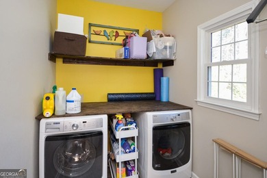 Imagine pulling into the driveway of a stunning traditional on Canongate At Eagle Watch Golf Club in Georgia - for sale on GolfHomes.com, golf home, golf lot