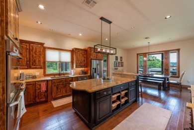 Welcome to 109 King Shore Blvd, a luxury waterfront retreat in on Cypress Creek Country Club in Texas - for sale on GolfHomes.com, golf home, golf lot