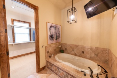 Welcome to 109 King Shore Blvd, a luxury waterfront retreat in on Cypress Creek Country Club in Texas - for sale on GolfHomes.com, golf home, golf lot