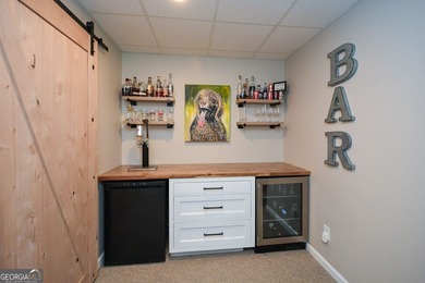 Imagine pulling into the driveway of a stunning traditional on Canongate At Eagle Watch Golf Club in Georgia - for sale on GolfHomes.com, golf home, golf lot