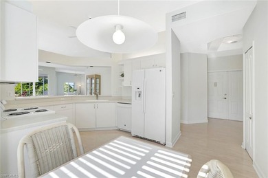 Enjoy elevated coastal living in this top-floor end unit at on Club at Pelican Bay Golf Course in Florida - for sale on GolfHomes.com, golf home, golf lot