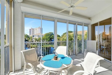 Enjoy elevated coastal living in this top-floor end unit at on Club at Pelican Bay Golf Course in Florida - for sale on GolfHomes.com, golf home, golf lot
