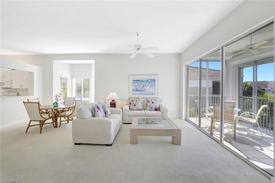 Enjoy elevated coastal living in this top-floor end unit at on Club at Pelican Bay Golf Course in Florida - for sale on GolfHomes.com, golf home, golf lot