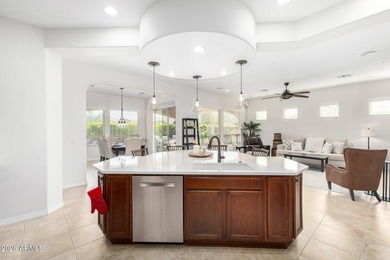 This beautifully maintained home features bright tile flooring on Trilogy Golf Club At Vistancia in Arizona - for sale on GolfHomes.com, golf home, golf lot