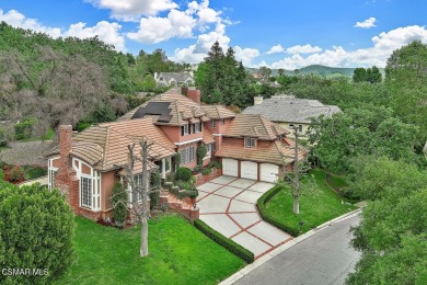 Nestled on a serene, tree-lined street in the prestigious on North Ranch Country Club in California - for sale on GolfHomes.com, golf home, golf lot