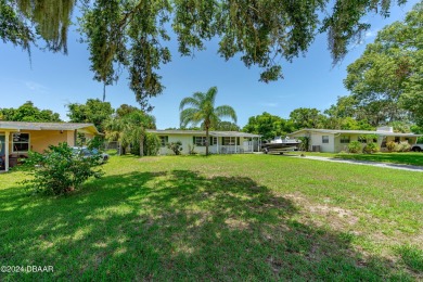 Living in paradise that is conveniently located to everything on New Smyrna Beach Golf Course in Florida - for sale on GolfHomes.com, golf home, golf lot