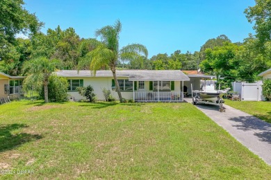 Living in paradise that is conveniently located to everything on New Smyrna Beach Golf Course in Florida - for sale on GolfHomes.com, golf home, golf lot