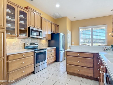 Listed BELOW APPRAISED VALUE, this 3-bedroom 2-bathroom home is on LPGA International Golf Course in Florida - for sale on GolfHomes.com, golf home, golf lot