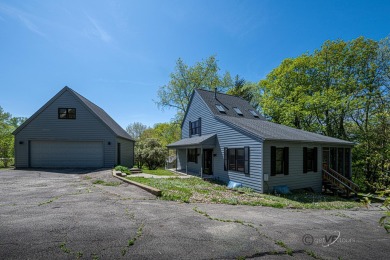 This Branigar farmhouse-style home is set on a beautiful, wooded on Eagle Ridge Inn and Resort in Illinois - for sale on GolfHomes.com, golf home, golf lot