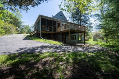 This Branigar farmhouse-style home is set on a beautiful, wooded on Eagle Ridge Inn and Resort in Illinois - for sale on GolfHomes.com, golf home, golf lot