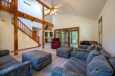 This Branigar farmhouse-style home is set on a beautiful, wooded on Eagle Ridge Inn and Resort in Illinois - for sale on GolfHomes.com, golf home, golf lot