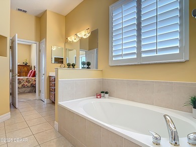 Listed BELOW APPRAISED VALUE, this 3-bedroom 2-bathroom home is on LPGA International Golf Course in Florida - for sale on GolfHomes.com, golf home, golf lot