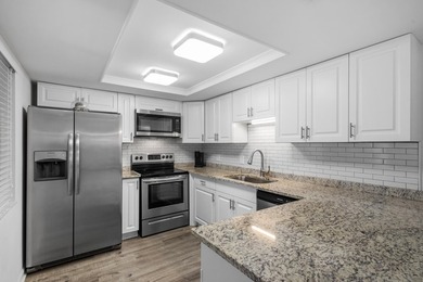 Beautifully updated 2 bedroom condo with a peak of ocean views on Ocean Village Golf Course in Florida - for sale on GolfHomes.com, golf home, golf lot