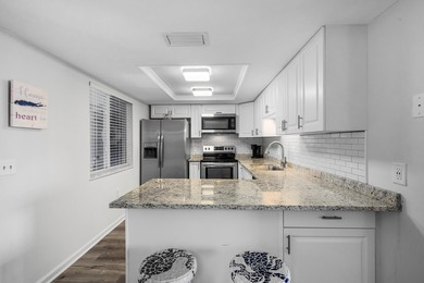 Beautifully updated 2 bedroom condo with a peak of ocean views on Ocean Village Golf Course in Florida - for sale on GolfHomes.com, golf home, golf lot