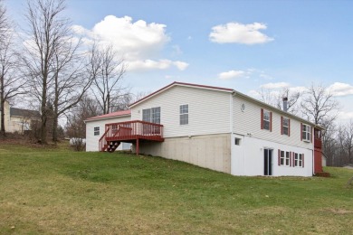 Welcome to 10291 Highland Green Drive, a 3-bedroom, 3-bath home on Lake LeAnn Golf Course in Michigan - for sale on GolfHomes.com, golf home, golf lot