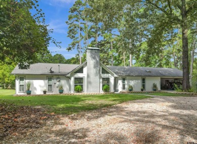 This spacious home sitting on the 16th fairway in Holly Lake on Holly Lake Ranch Golf Club in Texas - for sale on GolfHomes.com, golf home, golf lot