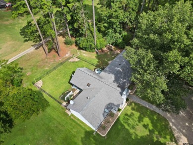 This spacious home sitting on the 16th fairway in Holly Lake on Holly Lake Ranch Golf Club in Texas - for sale on GolfHomes.com, golf home, golf lot