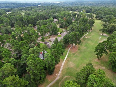 This spacious home sitting on the 16th fairway in Holly Lake on Holly Lake Ranch Golf Club in Texas - for sale on GolfHomes.com, golf home, golf lot