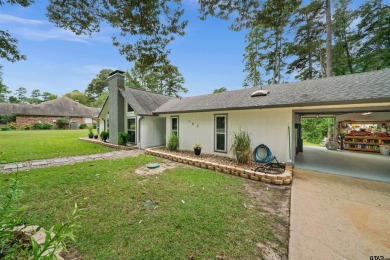 This spacious home sitting on the 16th fairway in Holly Lake on Holly Lake Ranch Golf Club in Texas - for sale on GolfHomes.com, golf home, golf lot