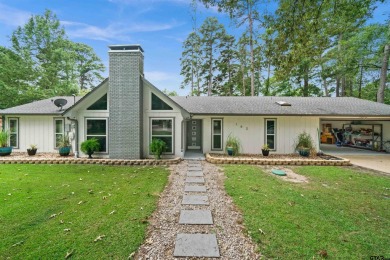 This spacious home sitting on the 16th fairway in Holly Lake on Holly Lake Ranch Golf Club in Texas - for sale on GolfHomes.com, golf home, golf lot