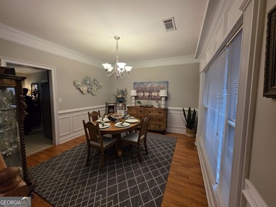 Welcome to this beautifully maintained all-brick home, ideally on Canongate At Georgia National Golf Club in Georgia - for sale on GolfHomes.com, golf home, golf lot