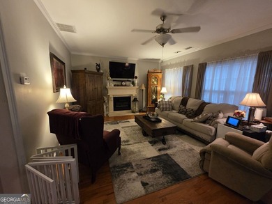 Welcome to this beautifully maintained all-brick home, ideally on Canongate At Georgia National Golf Club in Georgia - for sale on GolfHomes.com, golf home, golf lot