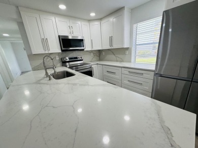 Enjoy life on the water with lake and golf course views from on Kings Point Golf -Flanders Way in Florida - for sale on GolfHomes.com, golf home, golf lot