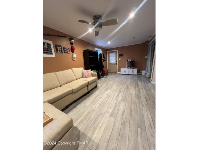 Come check out this UPDATED COZY CHALET/Raised Ranch with a on Pocono Farms Country Club in Pennsylvania - for sale on GolfHomes.com, golf home, golf lot
