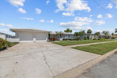 Tucked away in the prestigious waterfront enclave of Dana Shores on Rocky Point Golf Course in Florida - for sale on GolfHomes.com, golf home, golf lot